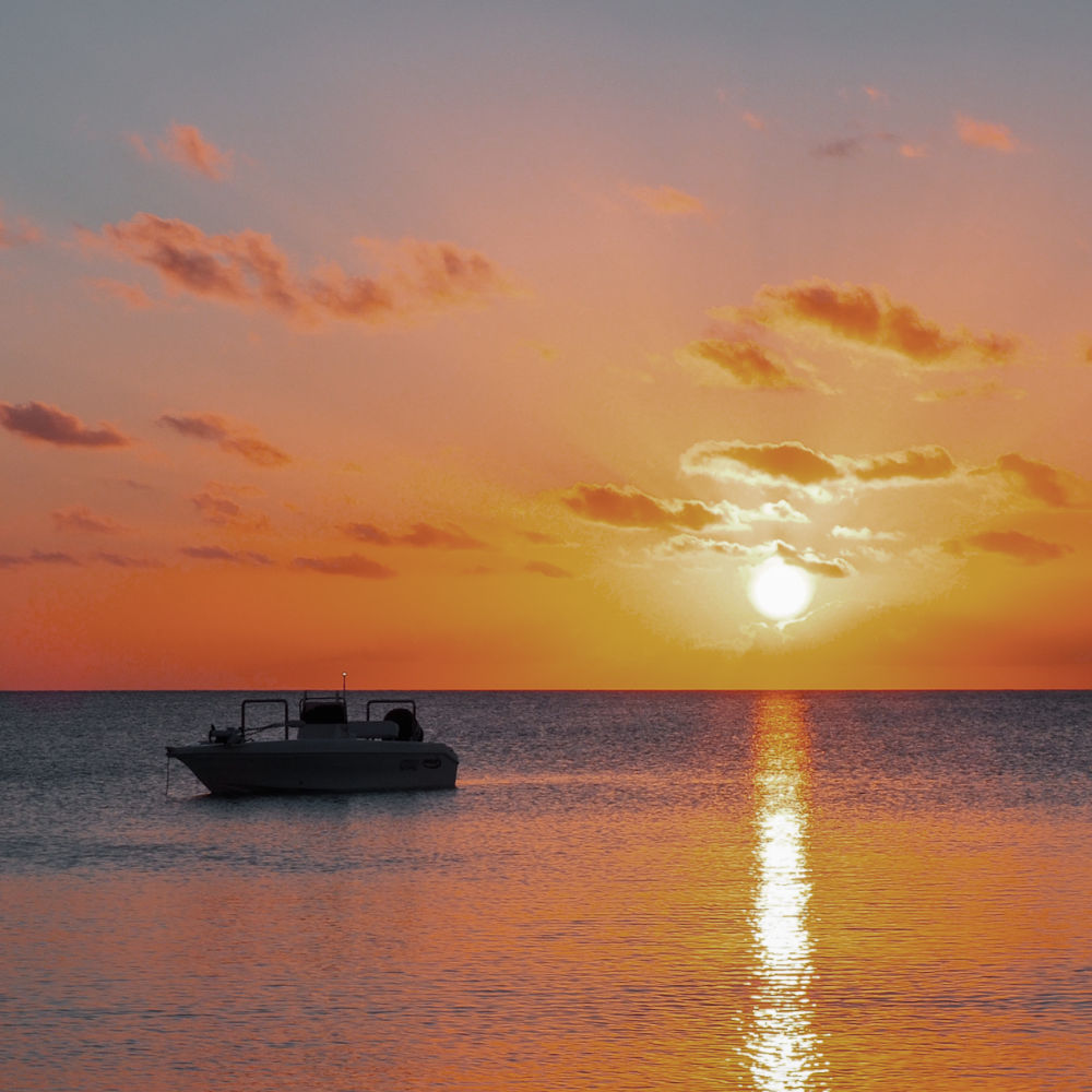 boat on water during golden sunset near fraser island
